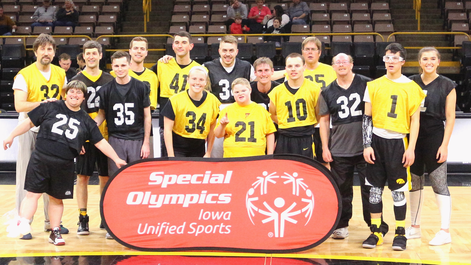 Special Olympics Iowa Unified Sports in front of champion unified athletics basketball team.