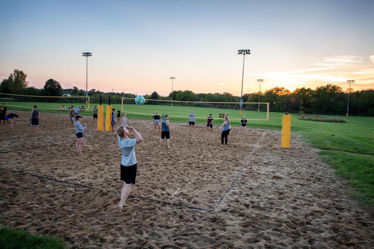 People playing sand volleyball at the Hawkeye Rec Fields