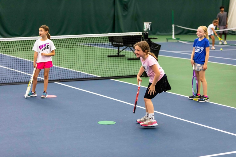 Kids participating in a youth tennis class
