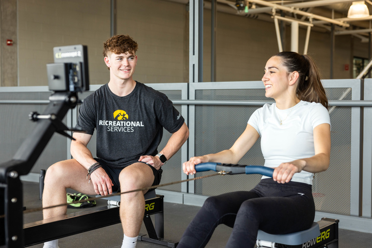 Personal trainer working with a client.