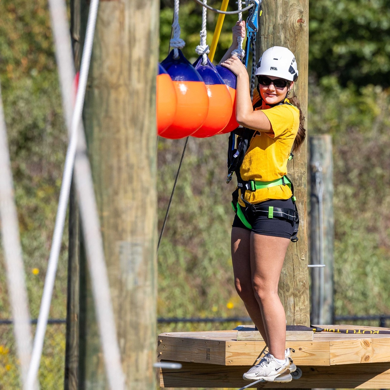 A participant on the high elements of the UI Challenge Course
