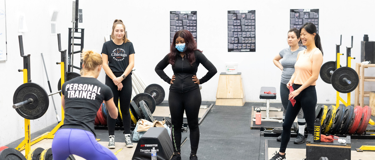 women in a weightlifting class
