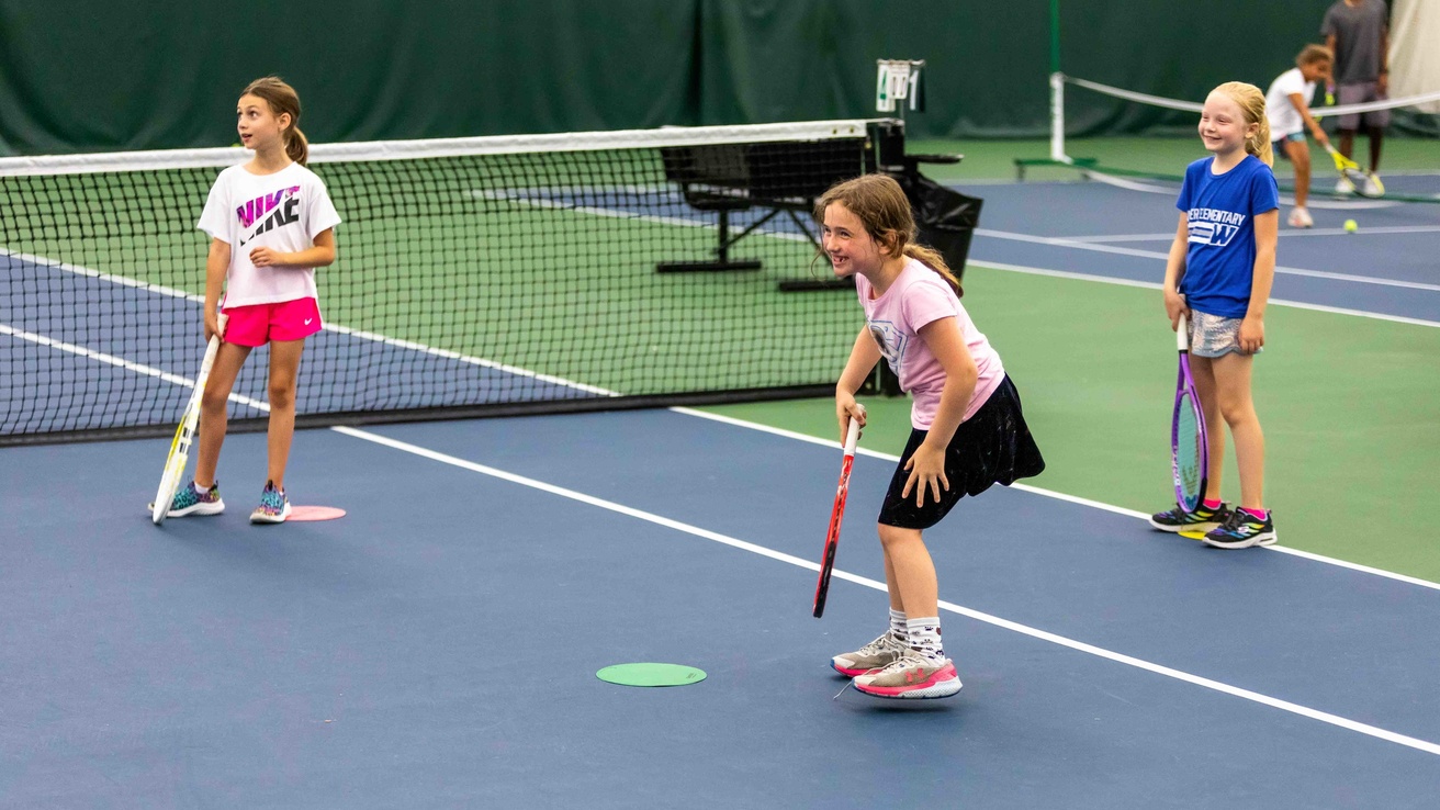 Kids participating in a youth tennis class